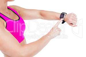 Female athlete using her smart watch