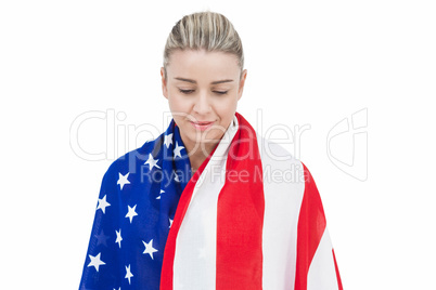 Female athlete with american flag on her shoulders