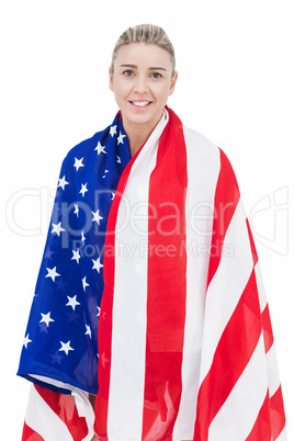 Female athlete with american flag on her shoulders