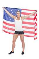 Female athlete holding American flag