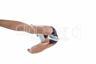 Low angle female athlete jumping