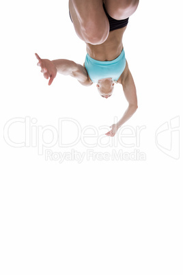 Low angle female athlete jumping