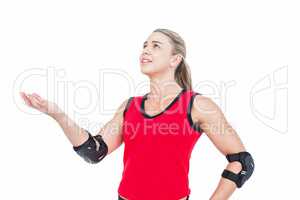 Female athlete with elbow pad throwing handball