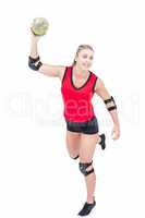 Female athlete with elbow pad throwing handball