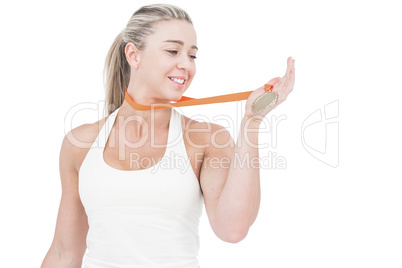 Female athlete holding medal