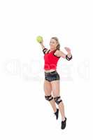 Female athlete with elbow pad throwing handball