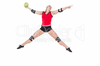 Female athlete with elbow pad throwing handball