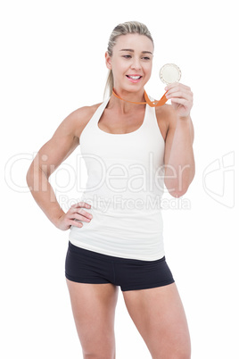 Female athlete holding medal