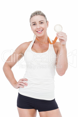 Female athlete holding medal