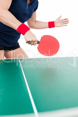 Ping pong player hitting the ball