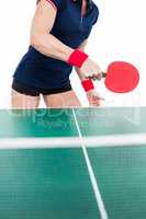 Ping pong player hitting the ball