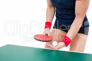 Female athlete playing ping pong