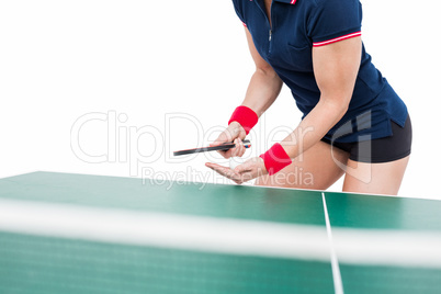 Female athlete playing ping pong