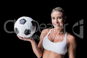 Female athlete holding a soccer ball