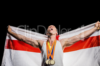 Athlete posing with gold medals after victory