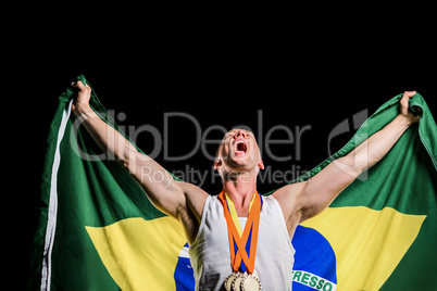 Athlete posing with gold medals after victory