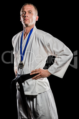 Fighter posing with medal around his neck