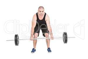 Bodybuilder lifting heavy barbell weights