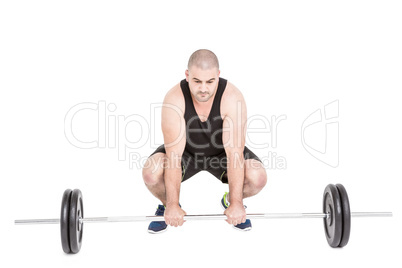 Bodybuilder lifting heavy barbell weights