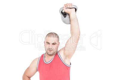 Bodybuilder lifting heavy kettlebell