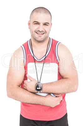Athlete posing with sport timer and clipboard