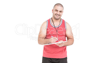 Athlete writing on clipboard