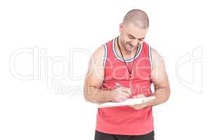 Athlete writing on clipboard