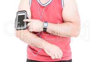 Athlete listening music on smartphone