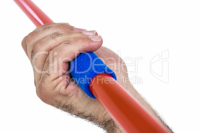 Close-up of hand holding javelin