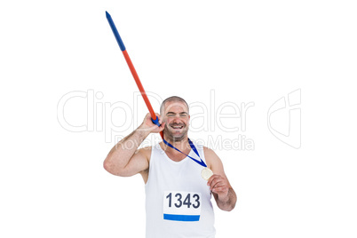 Athlete with olympic gold medal holding javelin