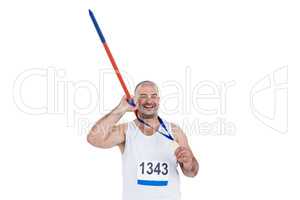 Athlete with olympic gold medal holding javelin