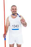 Athlete with olympic gold medal holding javelin