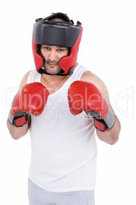 Boxer wearing head protector and gloves