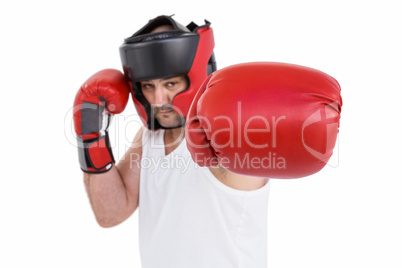 Boxer wearing head protector and gloves