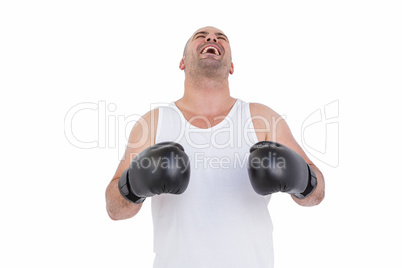 Boxer in boxing gloves laughing