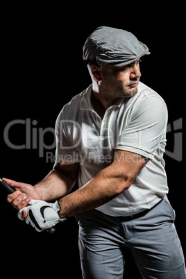Portrait of golf player taking a shot