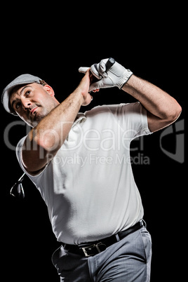 Portrait of golf player taking a shot