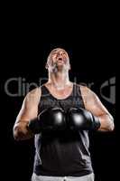 Boxer in boxing gloves laughing