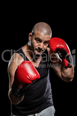 Portrait of boxer performing uppercut