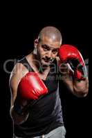 Portrait of boxer performing uppercut