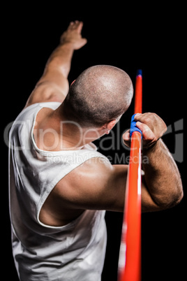 Rear view of athlete preparing to throw javelin
