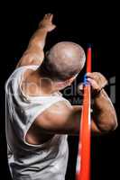 Rear view of athlete preparing to throw javelin