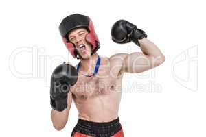 Boxer wearing medal performing boxing stance