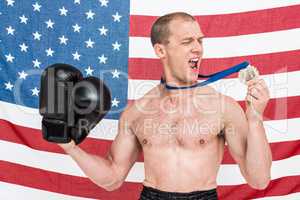 Excited boxer looking at his gold medal