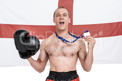 Excited boxer showing his gold medal