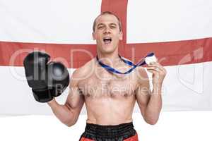 Excited boxer showing his gold medal