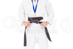 Fighter posing with medal around his neck