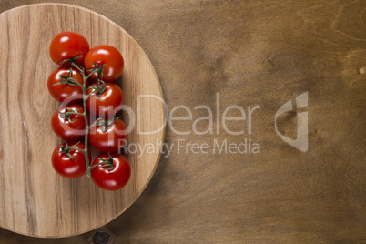 Tomato branch on vintage wood table