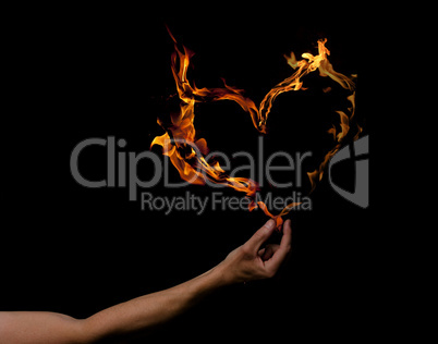 Hand with heart shaped flames
