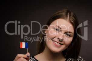 Beautiful woman with a French flag